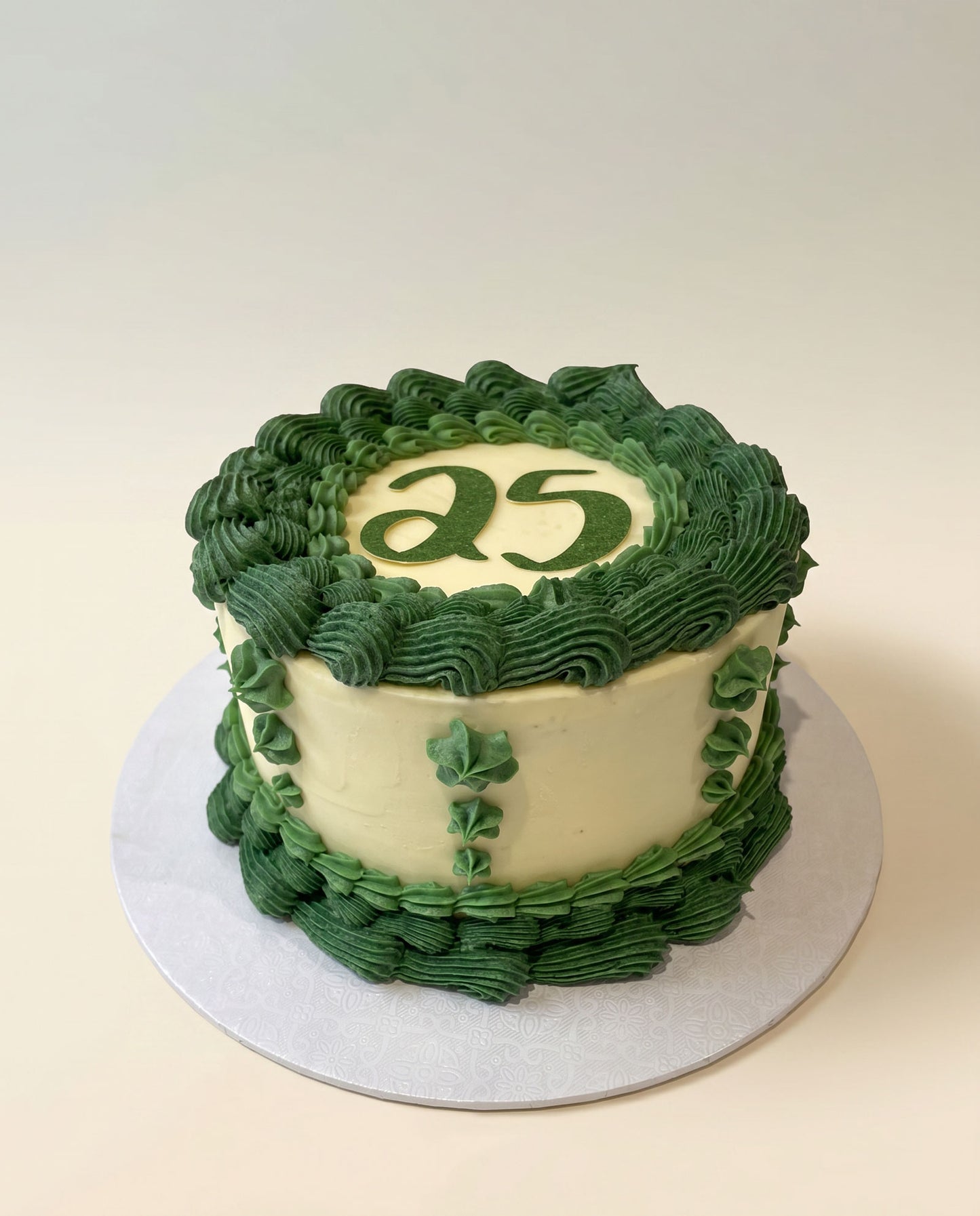Green hand-piped buttercream celebration cake shown as an example of colour-customisable piping, handmade by Daisy Mud Pie in Brentwood, Essex