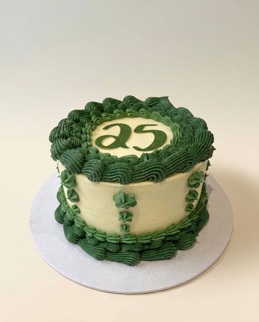 Green hand-piped buttercream celebration cake shown as an example of colour-customisable piping, handmade by Daisy Mud Pie in Brentwood, Essex
