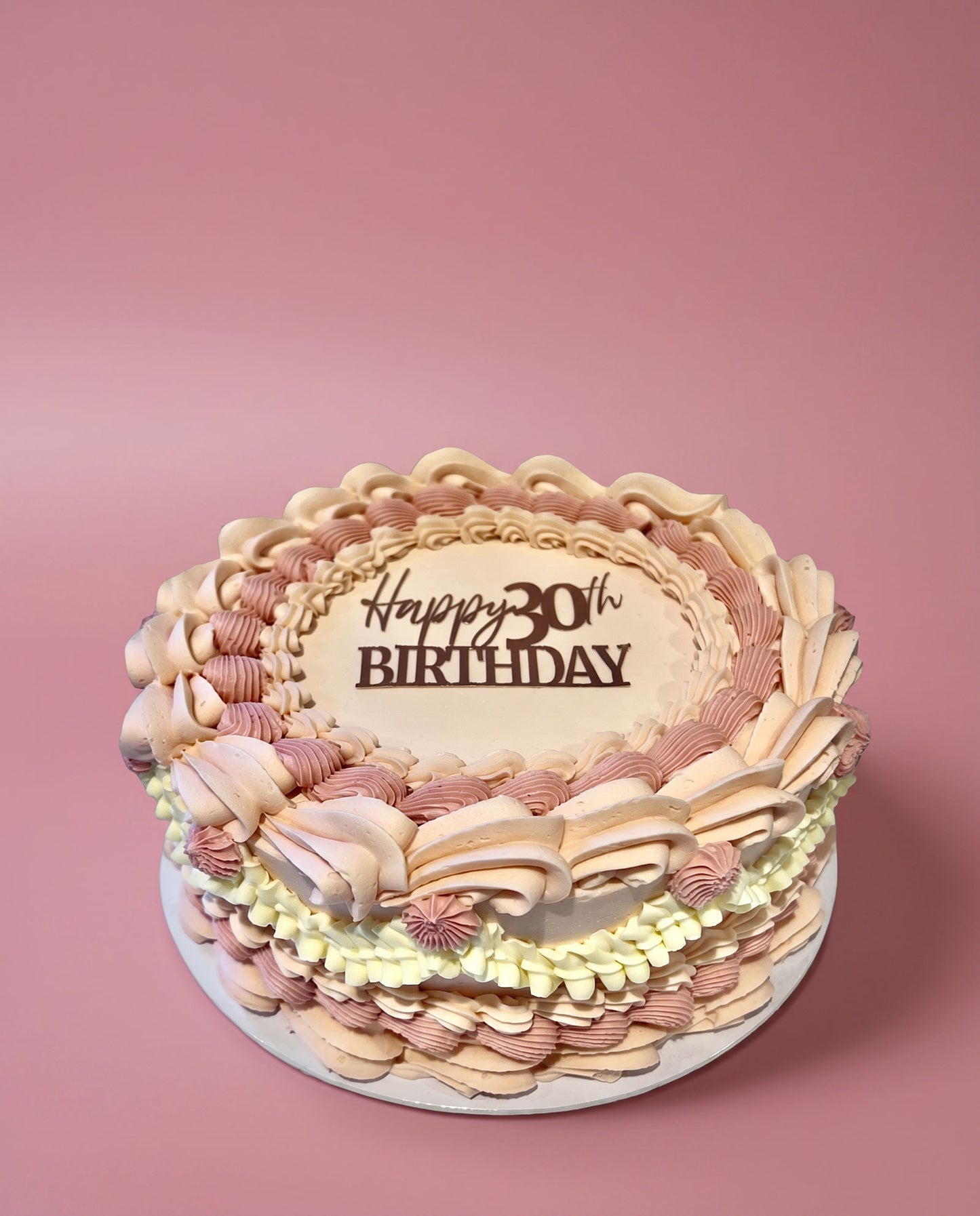 Rose gold hand-piped buttercream celebration cake with a happy 30th topper, handmade by Daisy Mud Pie in Brentwood, Essex